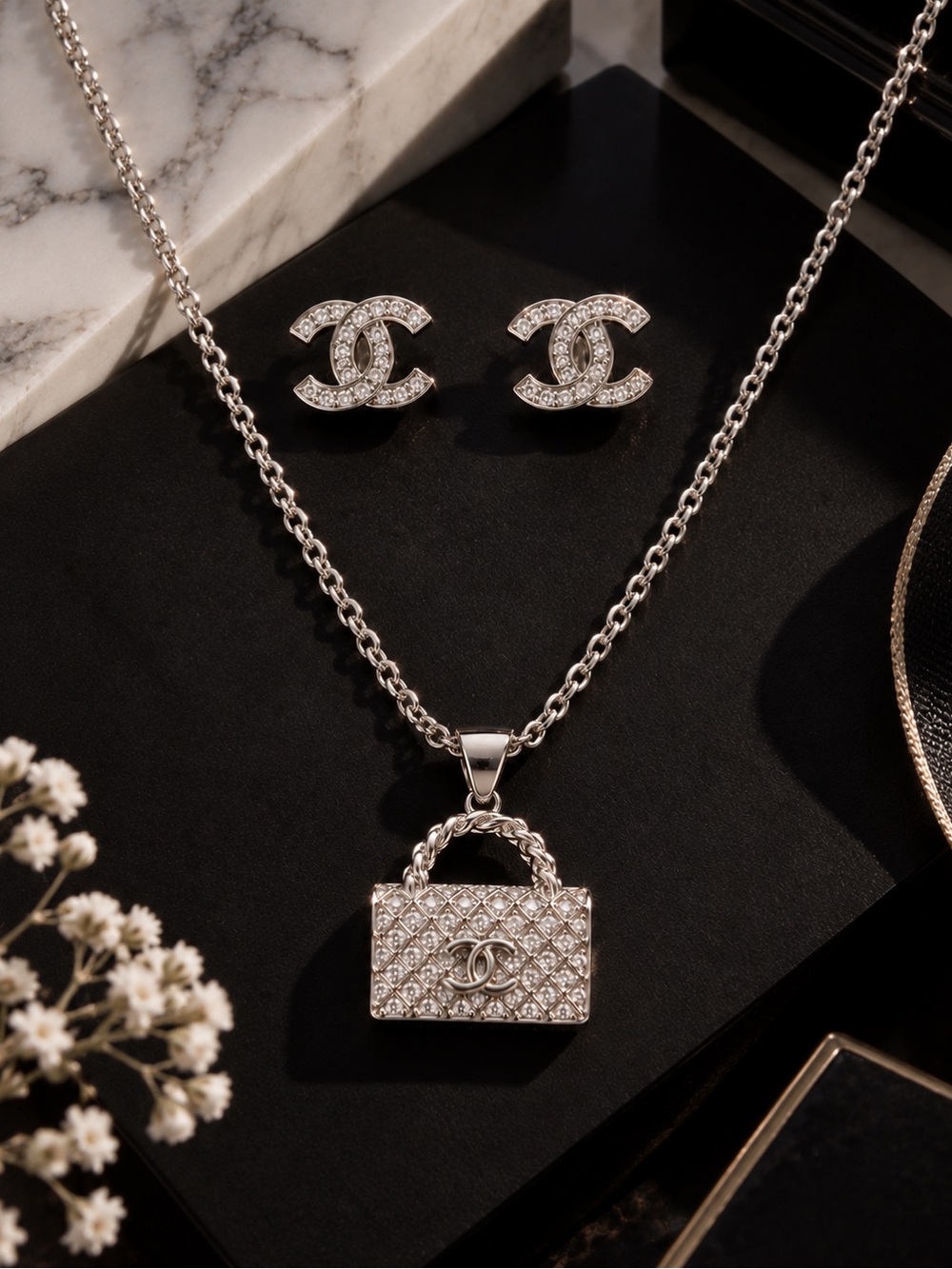 Silver Crystal Quilted Handbag Pendant Necklace with Matching Logo Studs